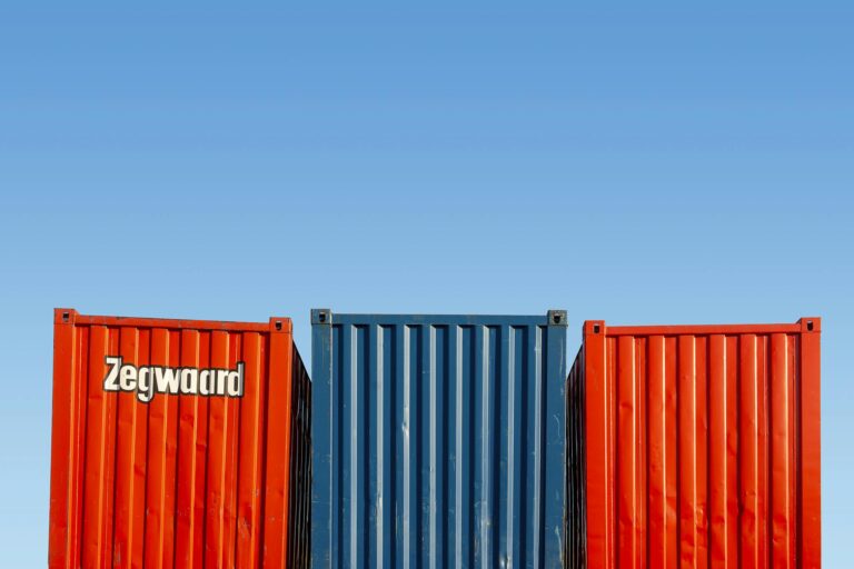 Colorful shipping containers under clear skies, perfect for logistic themes.